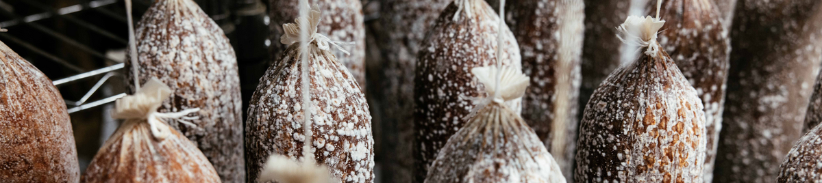 Whole muscles hanging to air dry in the curing room